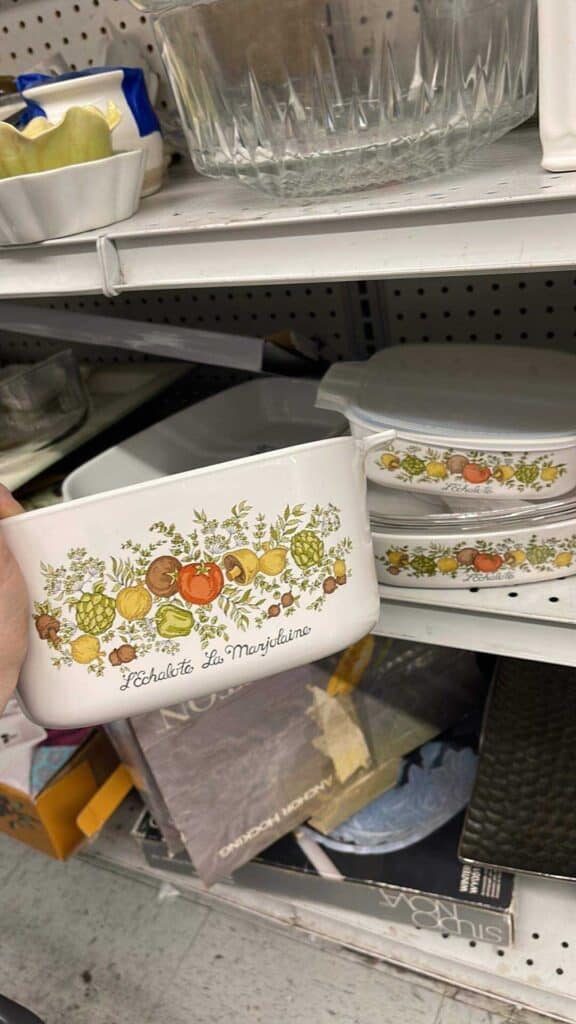 Vintage Corningware L'Echalote, La Marjolaine casserole dish with vegetable pattern found on a thrift store shelf.